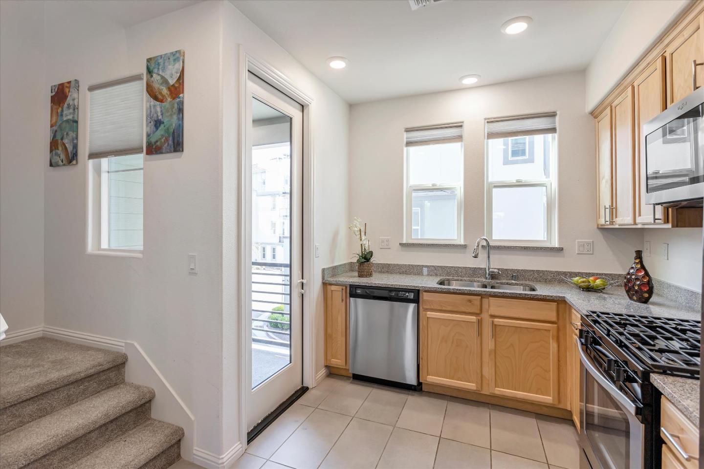 1475 Cherry Circle Milpitas, CA 95035 - Photo 5 of 33 a kitchen with a sink stove and cabinets