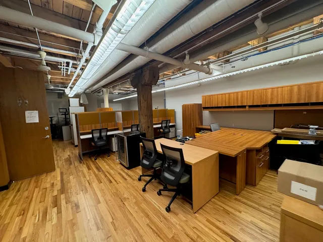 a view of a patio with table and chairs