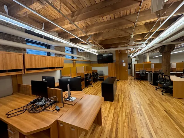 a view of a dining room with wooden floor
