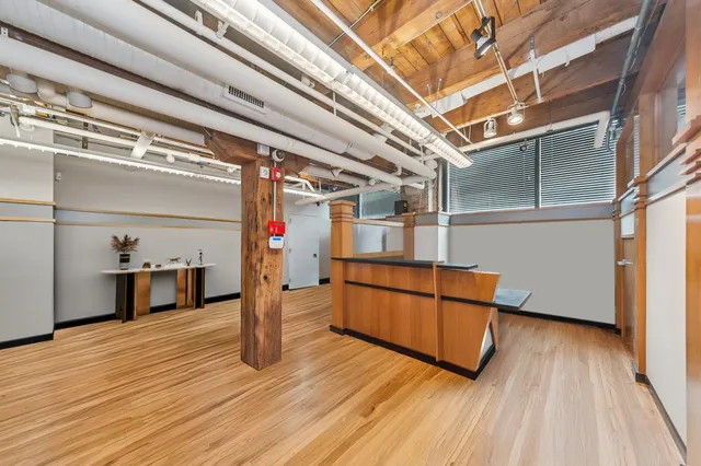 a view of a porch with wooden floor and electronic appliances