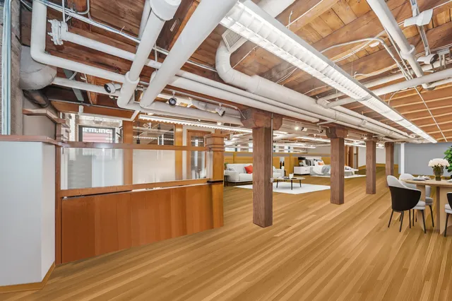 a view of a living room with wooden floor