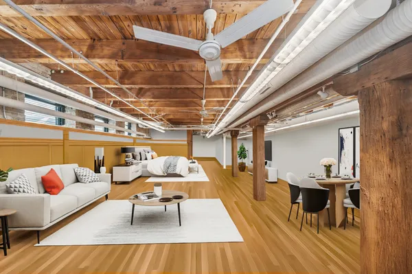 a living room with lots of furniture and a table