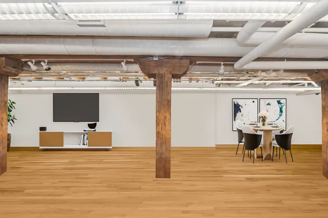 a view of kitchen with furniture and wooden floor