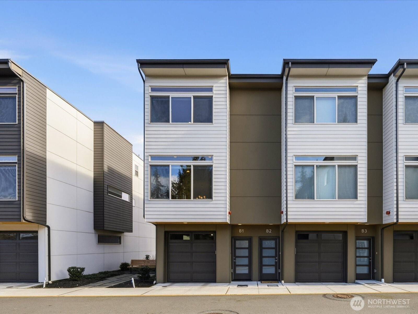 5020 148th Street Southwest, Unit B1 Edmonds, WA 98026 - Photo 1 of 31 a front view of multiple houses