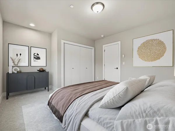 a bedroom with a bed and a lamp