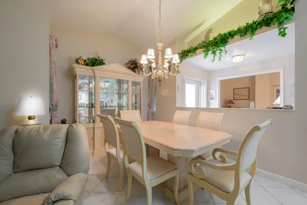 a dining room with furniture a livingroom and chandelier