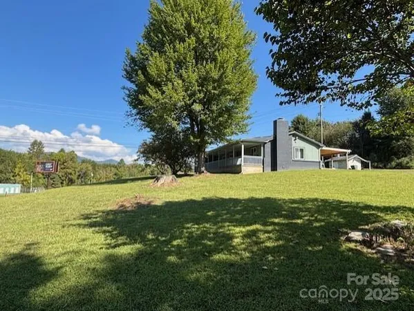a view of a house with a big yard