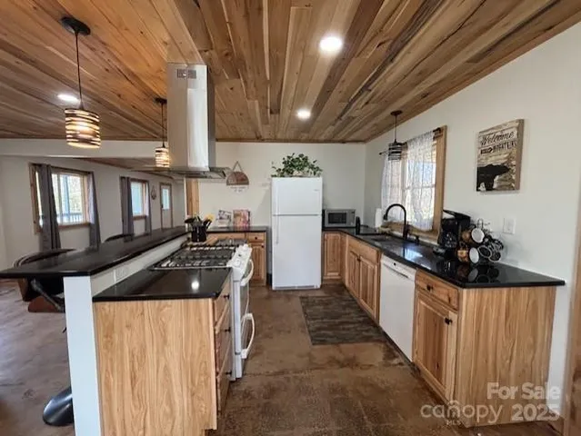 a kitchen with refrigerator and stove