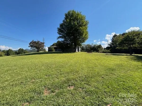 a view of a large pool with a yard