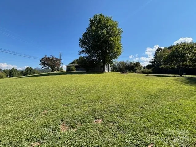 a view of a large pool with a yard