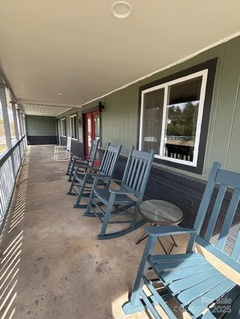 a view of a livingroom with furniture and windows