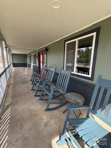 a view of a livingroom with furniture and windows
