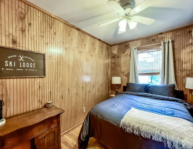 a bedroom with a bed and a window