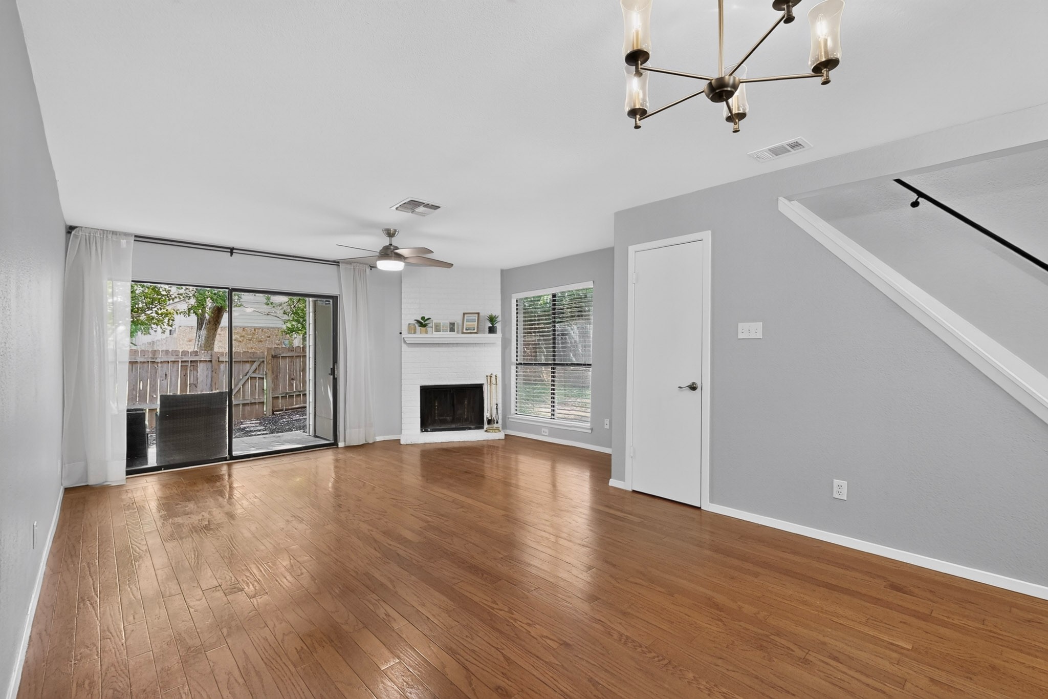 3801 Menchaca Road, Unit 25 Austin, TX 78704 - Photo 4 of 27 Living/dining room - Hardwood floors, fireplace, private patio space
