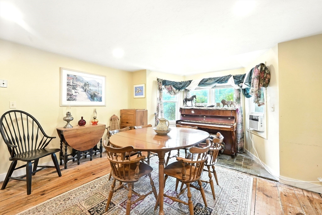 23 Westboro Road Upton, MA 01568 - Photo 16 of 42 a view of a dining room with furniture and wooden floor