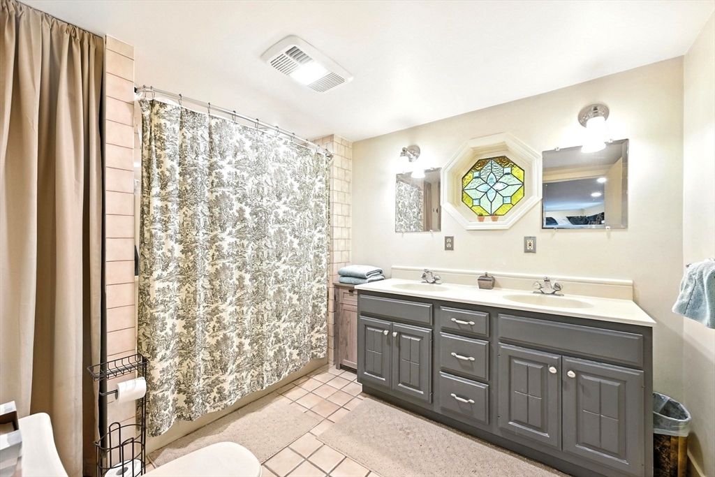23 Westboro Road Upton, MA 01568 - Photo 17 of 42 a bathroom with double vanity sink a mirror a shower and vanity