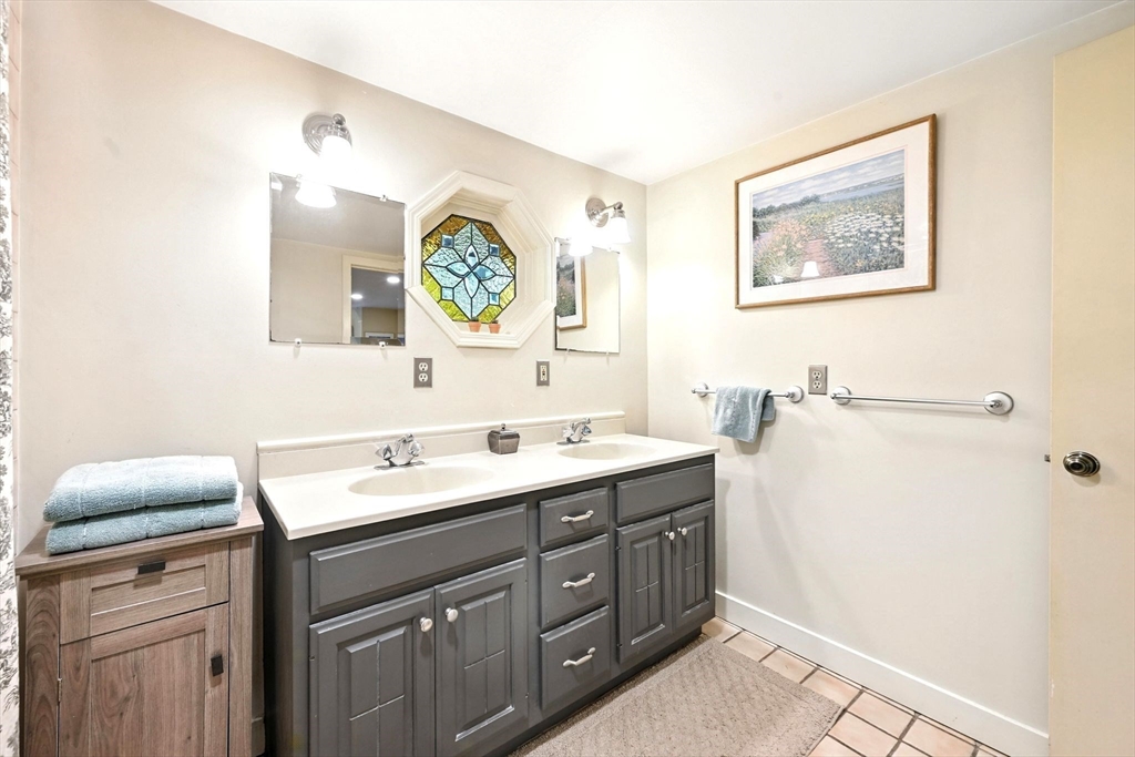 23 Westboro Road Upton, MA 01568 - Photo 18 of 42 a bathroom with a sink and a mirror