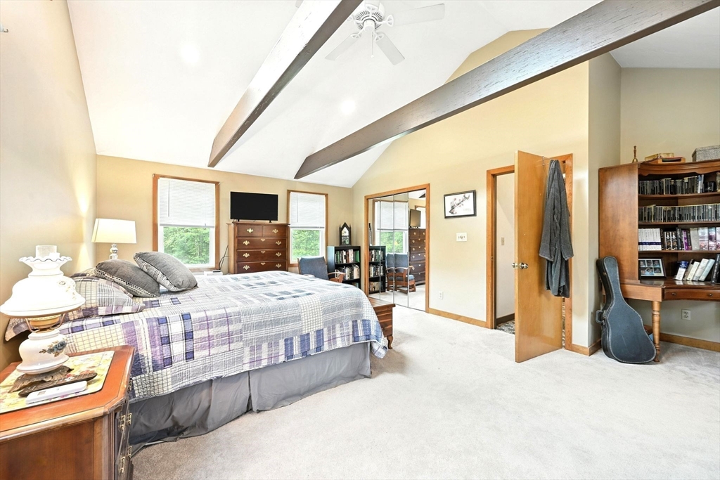 23 Westboro Road Upton, MA 01568 - Photo 21 of 42 a bedroom with a large bed and a large window