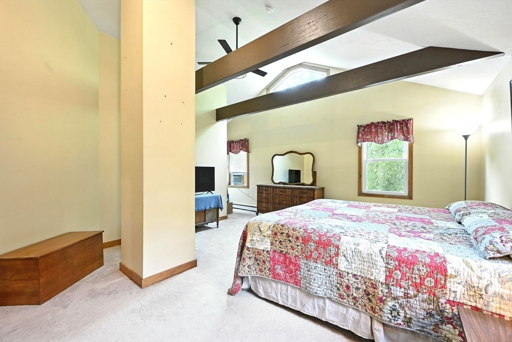 23 Westboro Road Upton, MA 01568 - Photo 23 of 42 a bedroom with a bed and a dresser