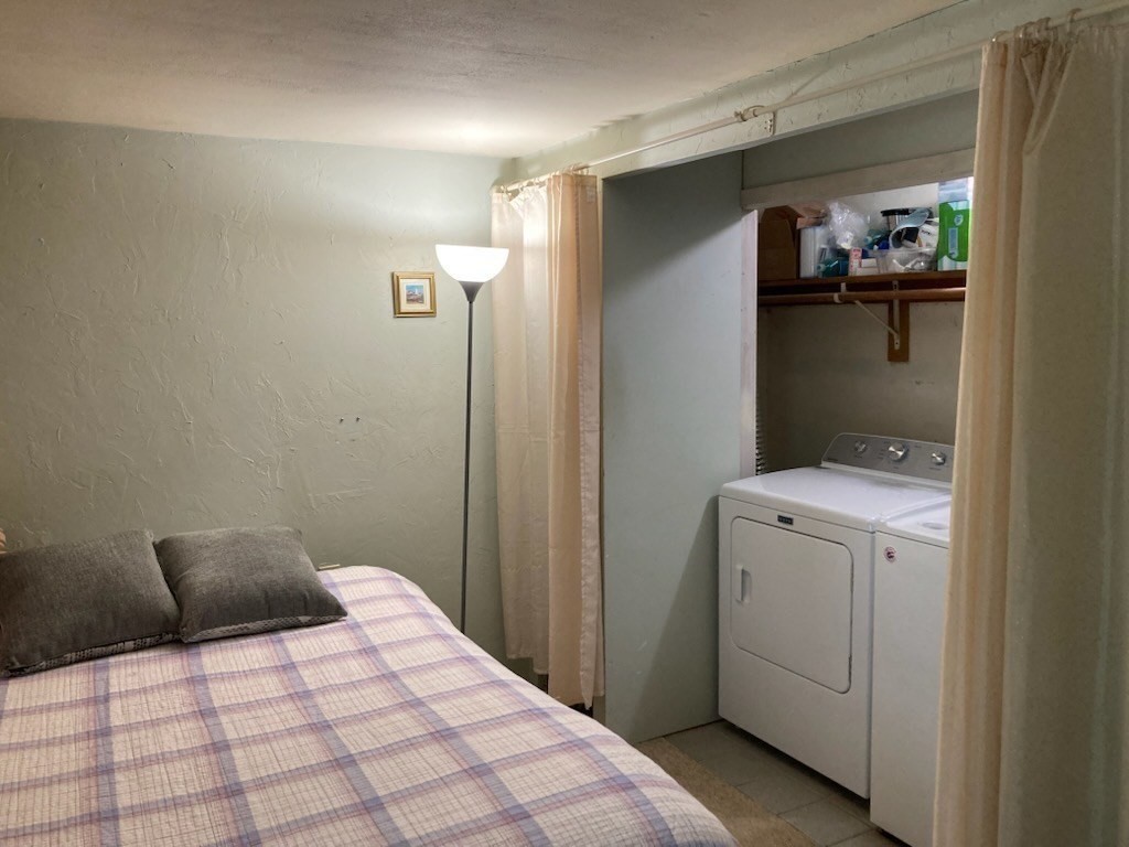 23 Westboro Road Upton, MA 01568 - Photo 27 of 42 a bedroom with a bed and a view of bathroom