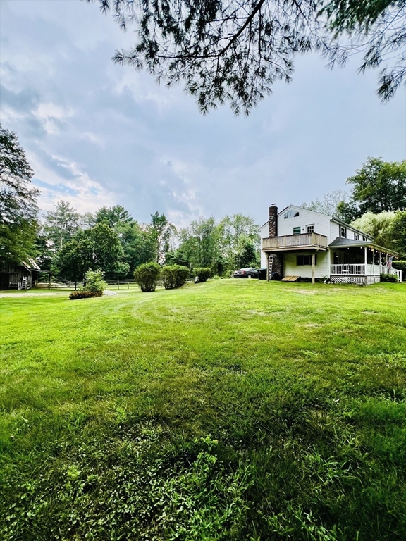 23 Westboro Road Upton, MA 01568 - Photo 31 of 42 a view of a house with a big yard and potted plants and large tree