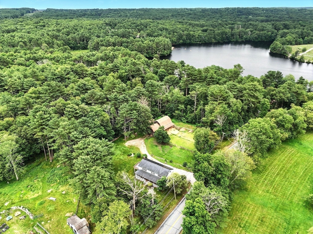 23 Westboro Road Upton, MA 01568 - Photo 41 of 42 an aerial view of green landscape with trees houses and lake view