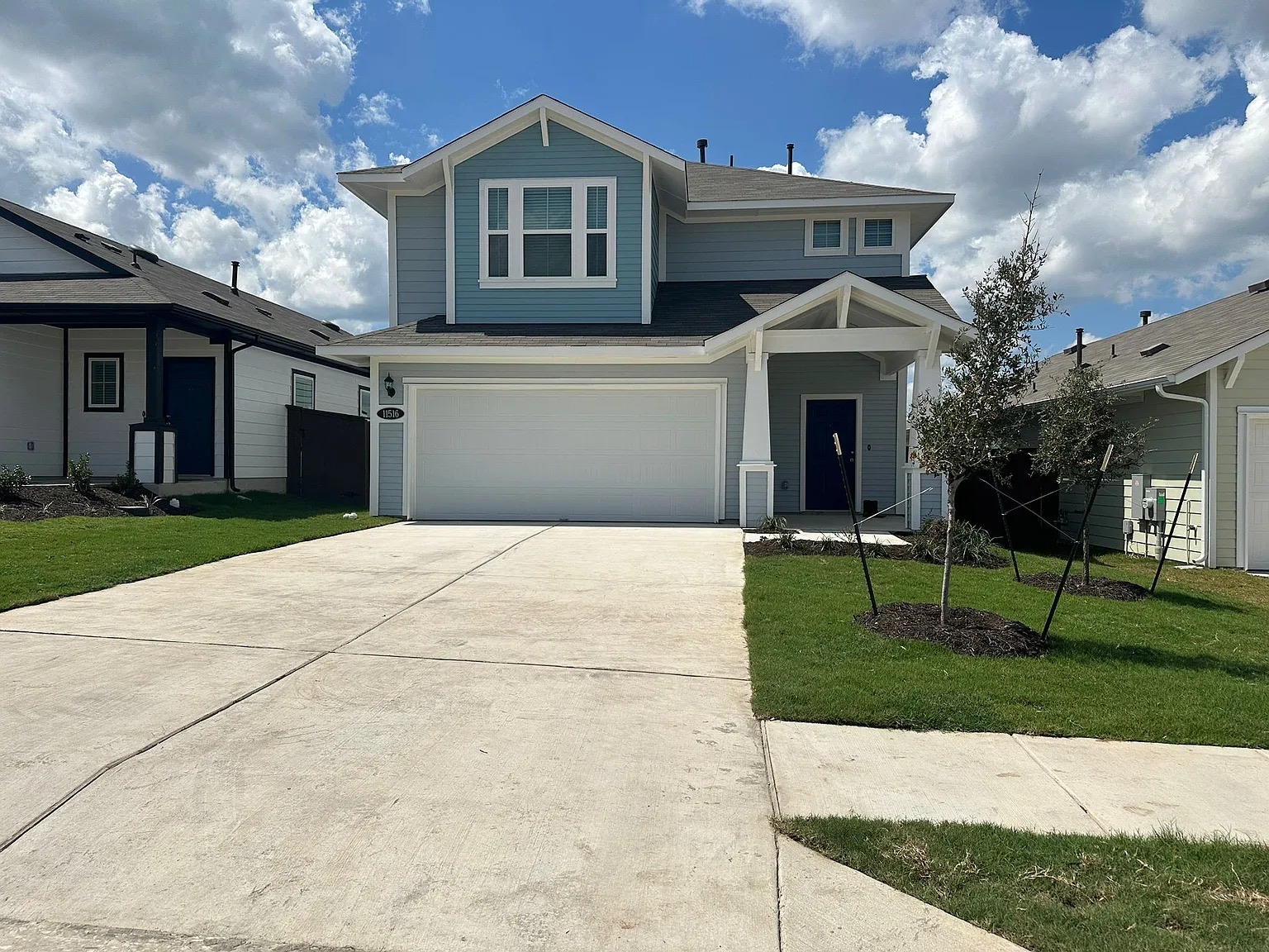 11516 Murano Drive Austin, TX 78747 - Photo 1 of 23 a front view of a house with a yard and garage