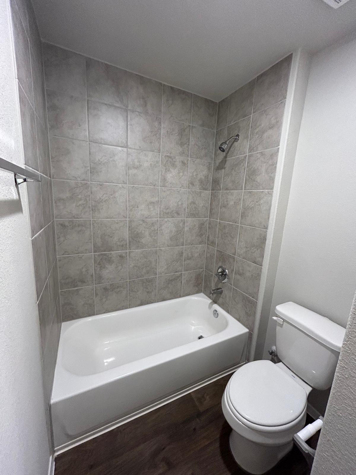 11516 Murano Drive Austin, TX 78747 - Photo 10 of 23 a view of a bathroom with a tub and toilet