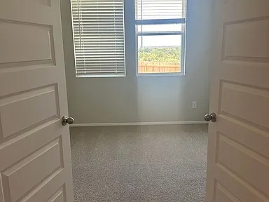 11516 Murano Drive Austin, TX 78747 - Photo 17 of 23 a view of an empty room with a window