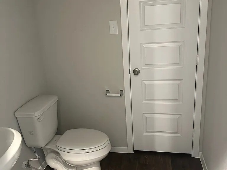 11516 Murano Drive Austin, TX 78747 - Photo 19 of 23 a white toilet sitting next to a bathroom sink