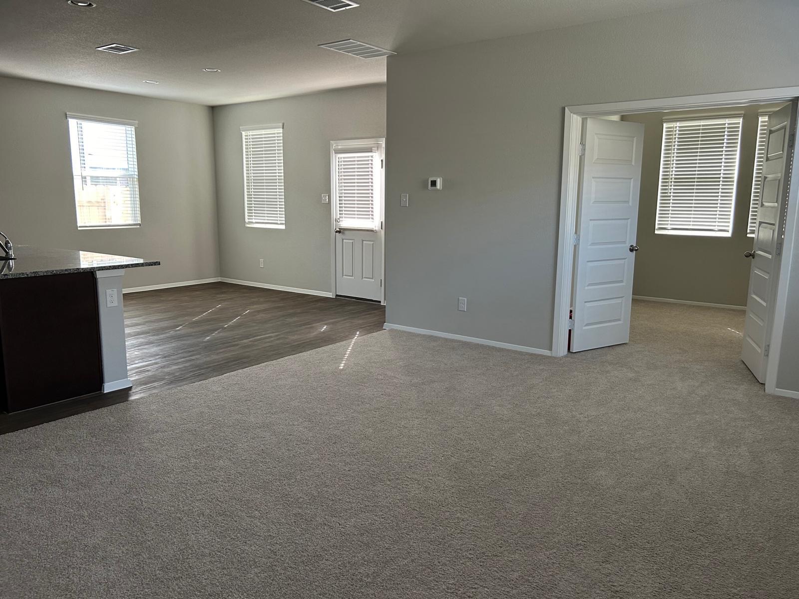 11516 Murano Drive Austin, TX 78747 - Photo 6 of 23 an empty room with windows