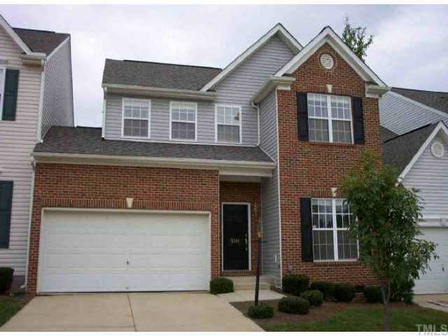 5304 Arete Way Raleigh, NC 27607 - Photo 1 of 1 a front view of a house with a yard and garage
