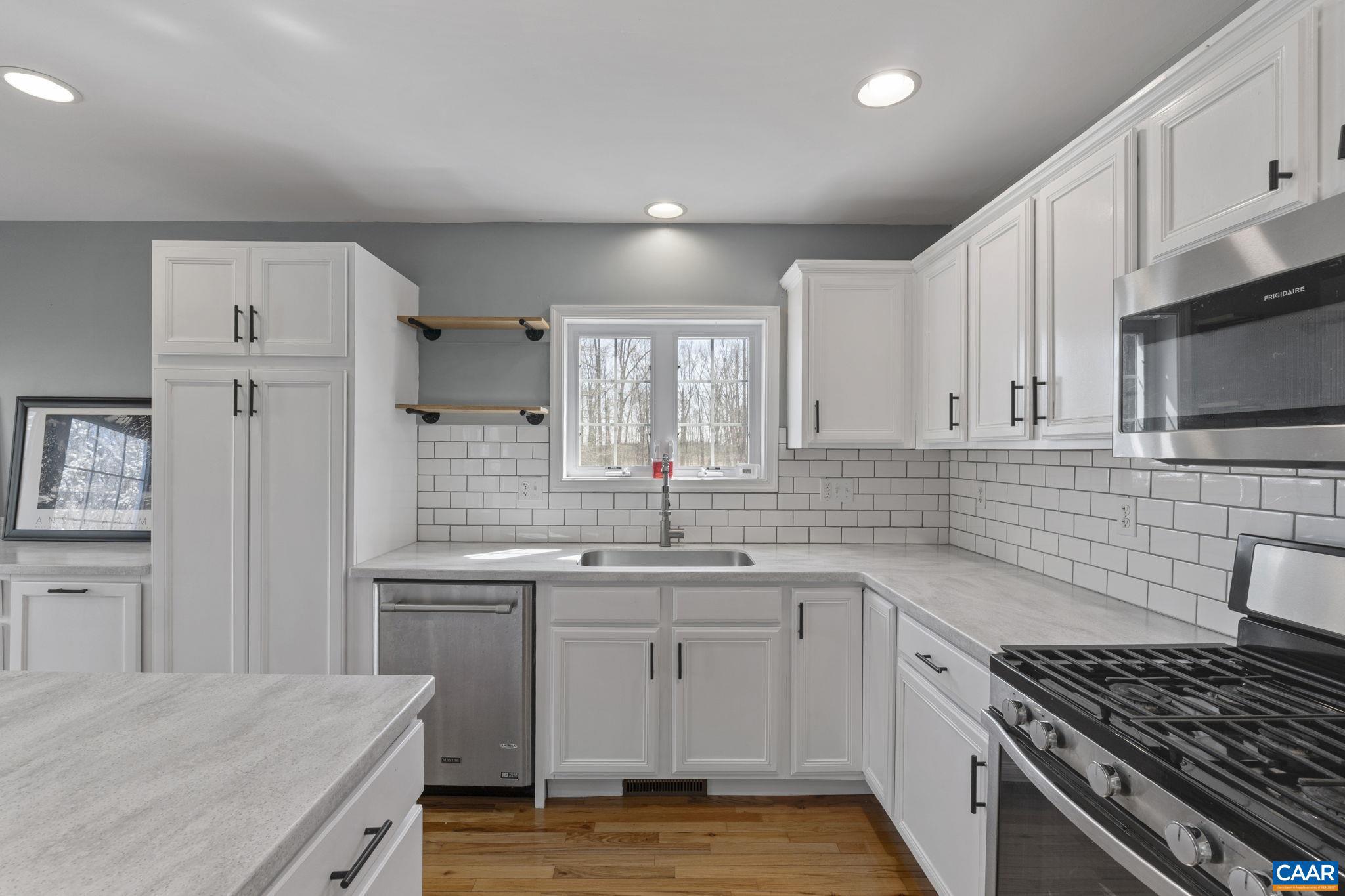 379 Fox Ridge Lane Palmyra, VA 22963 - Photo 14 of 42 a kitchen with a sink stove and cabinets
