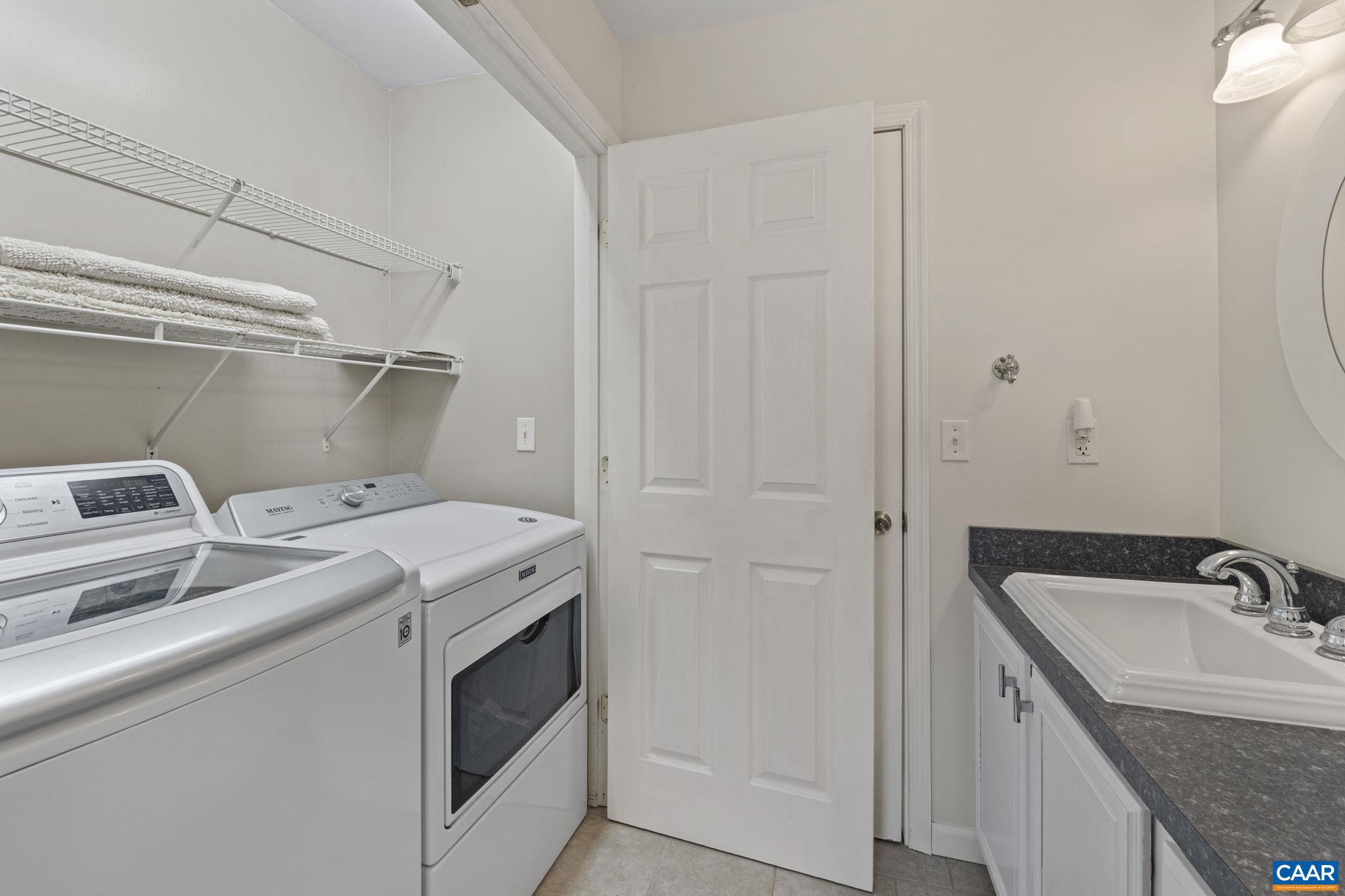 379 Fox Ridge Lane Palmyra, VA 22963 - Photo 18 of 42 a utility room with a sink washer and dryer