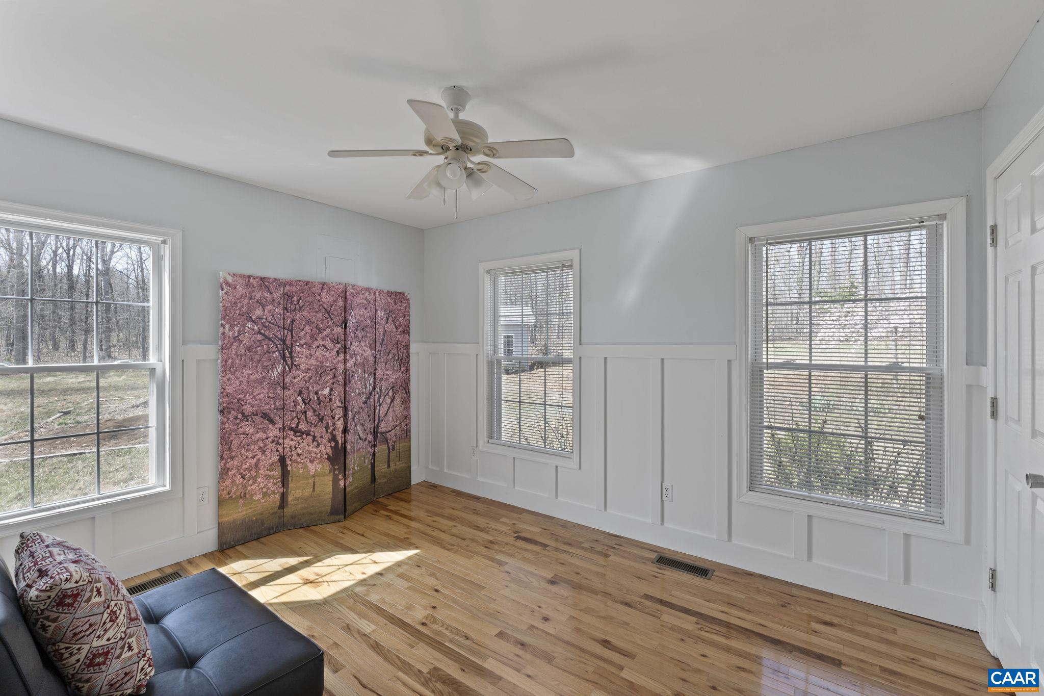 379 Fox Ridge Lane Palmyra, VA 22963 - Photo 19 of 42 a living room with furniture and windows