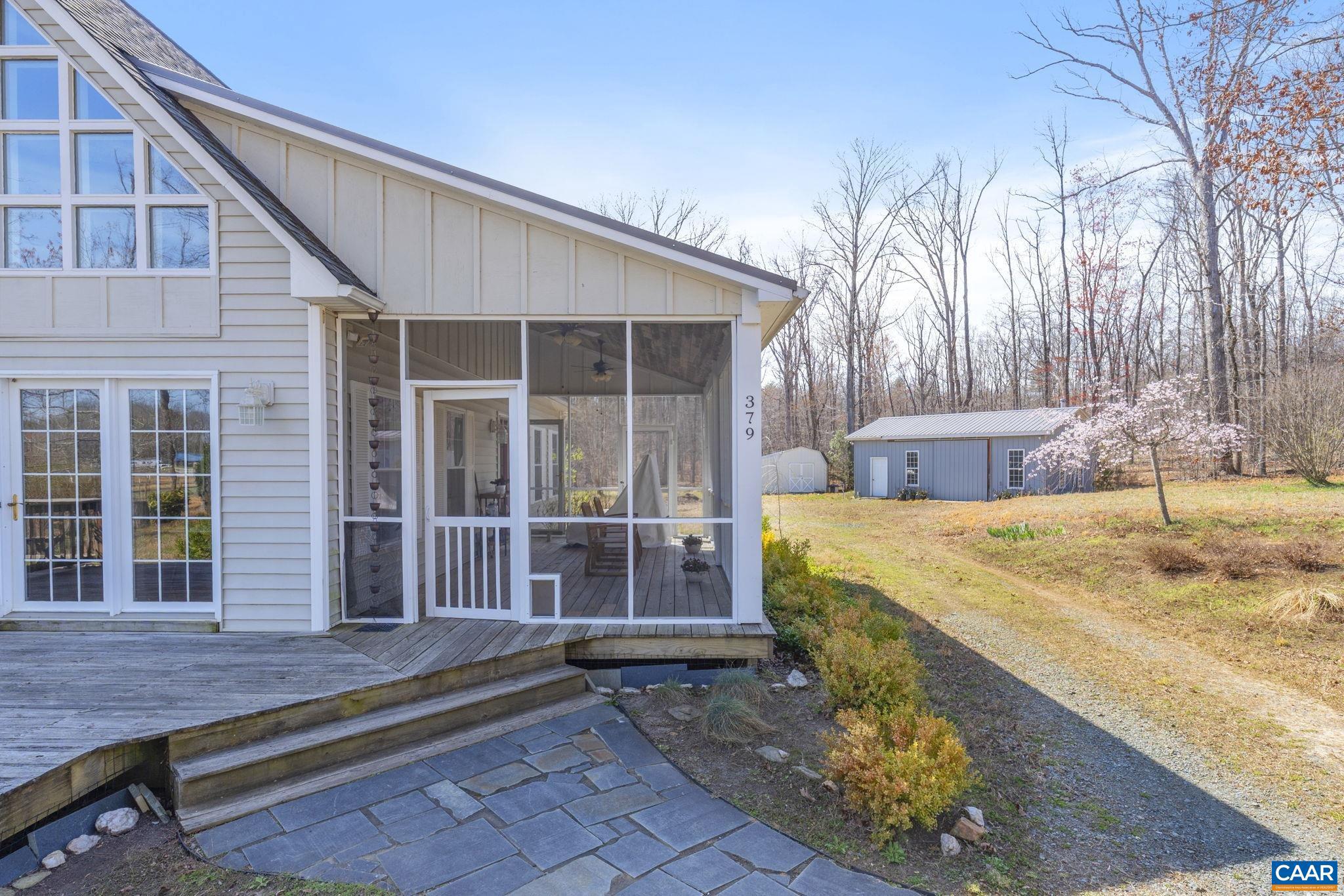 379 Fox Ridge Lane Palmyra, VA 22963 - Photo 2 of 42 a front view of a house with a garden