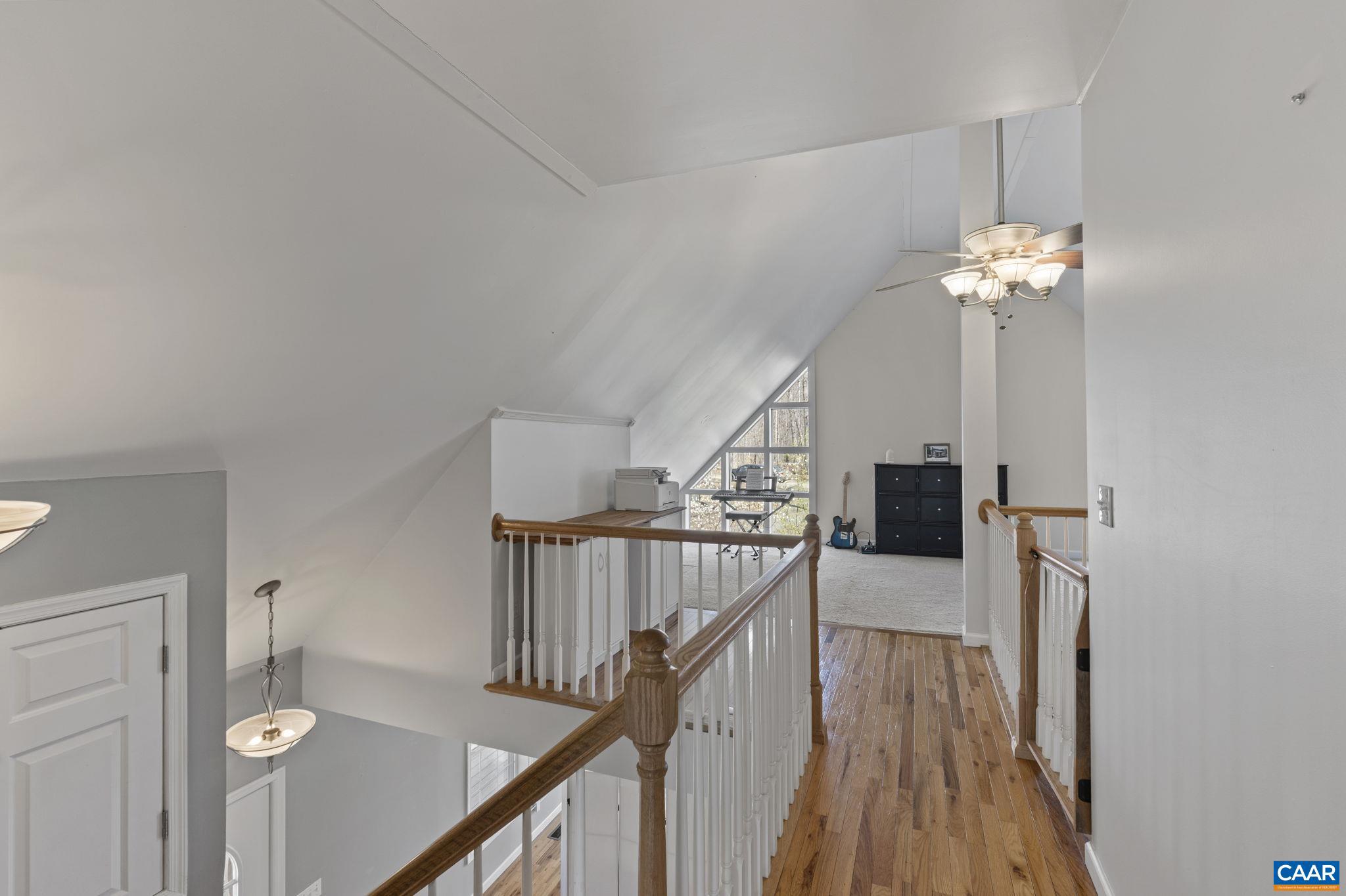 379 Fox Ridge Lane Palmyra, VA 22963 - Photo 27 of 42 a view of a hallway with wooden floor and staircase