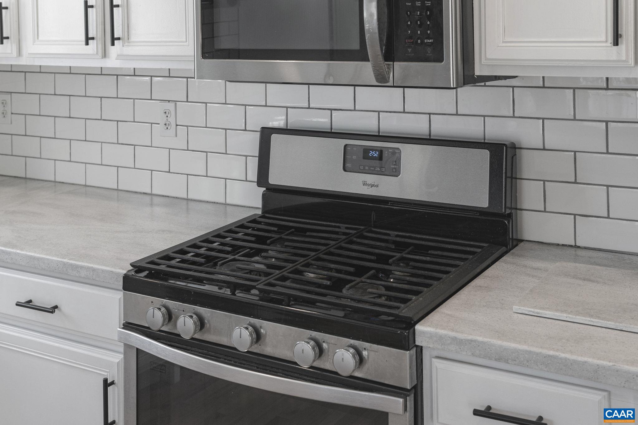 379 Fox Ridge Lane Palmyra, VA 22963 - Photo 28 of 42 a stove top oven sitting inside of a kitchen