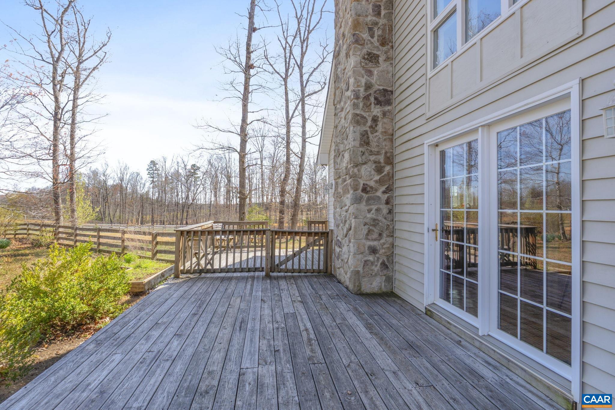 379 Fox Ridge Lane Palmyra, VA 22963 - Photo 30 of 42 a view of balcony with wooden floor and floor to ceiling window with wooden floor