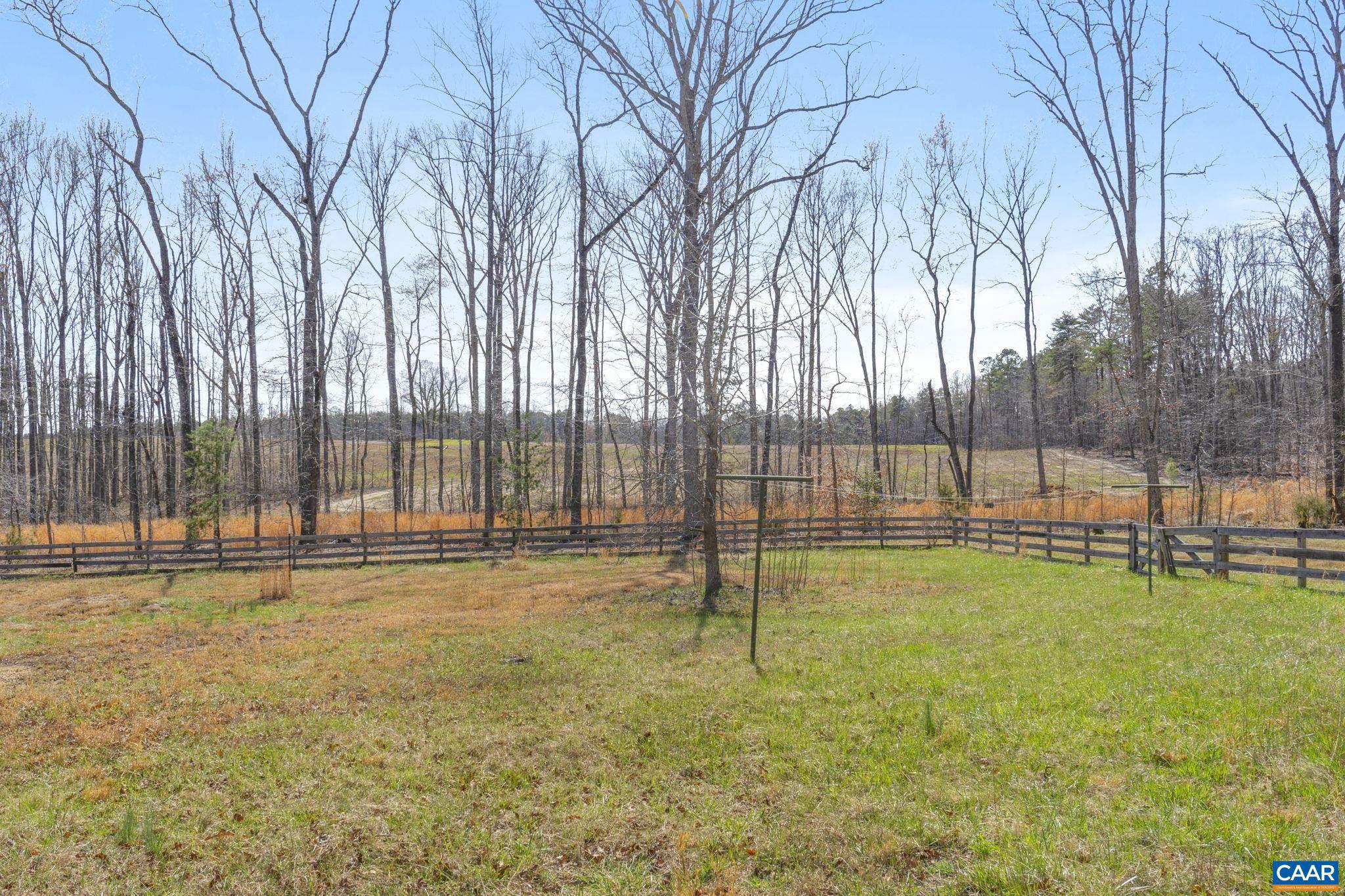379 Fox Ridge Lane Palmyra, VA 22963 - Photo 36 of 42 a view of a swimming pool with a bench and large trees