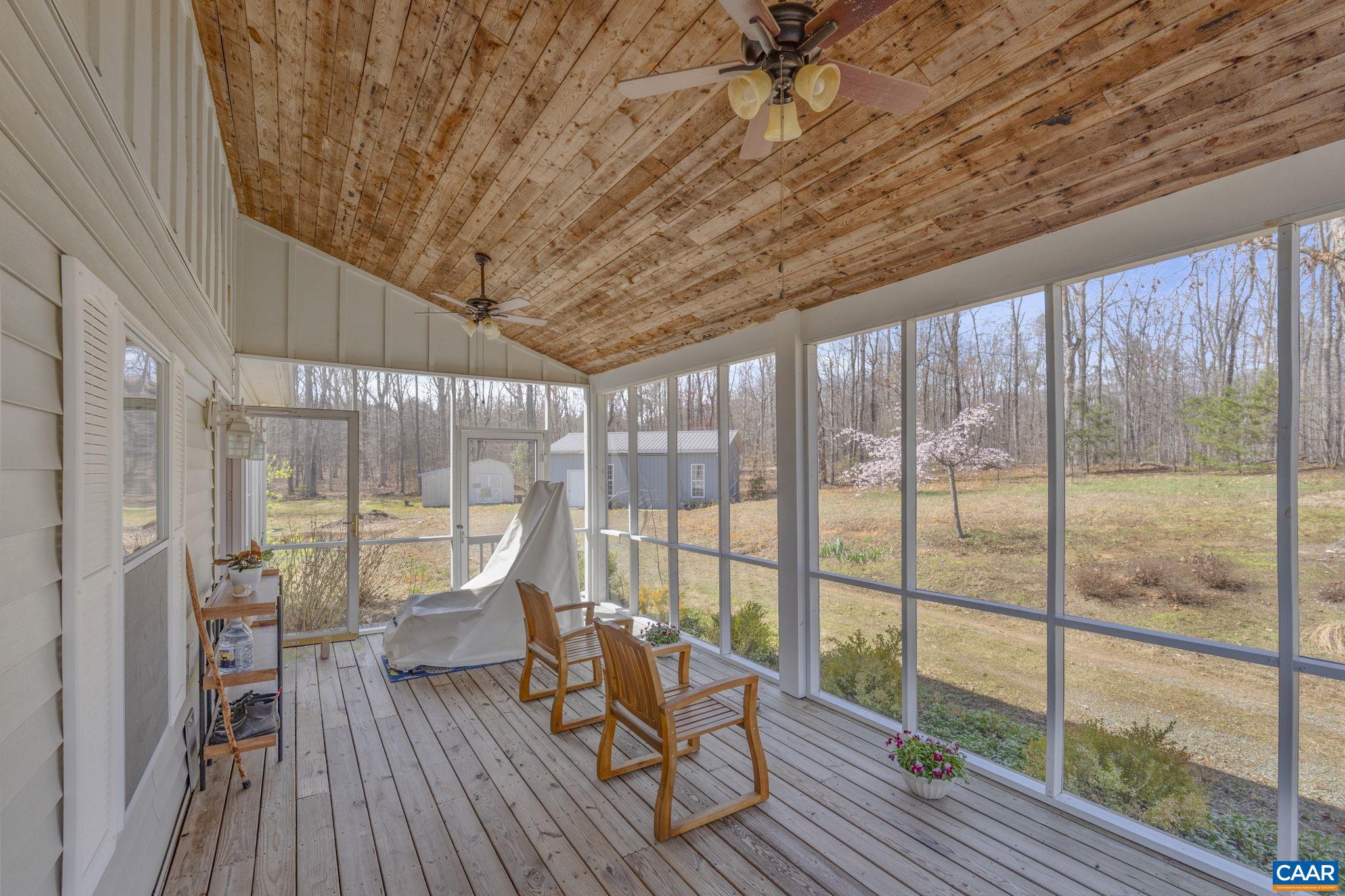 379 Fox Ridge Lane Palmyra, VA 22963 - Photo 38 of 42 a roof deck with table and chairs