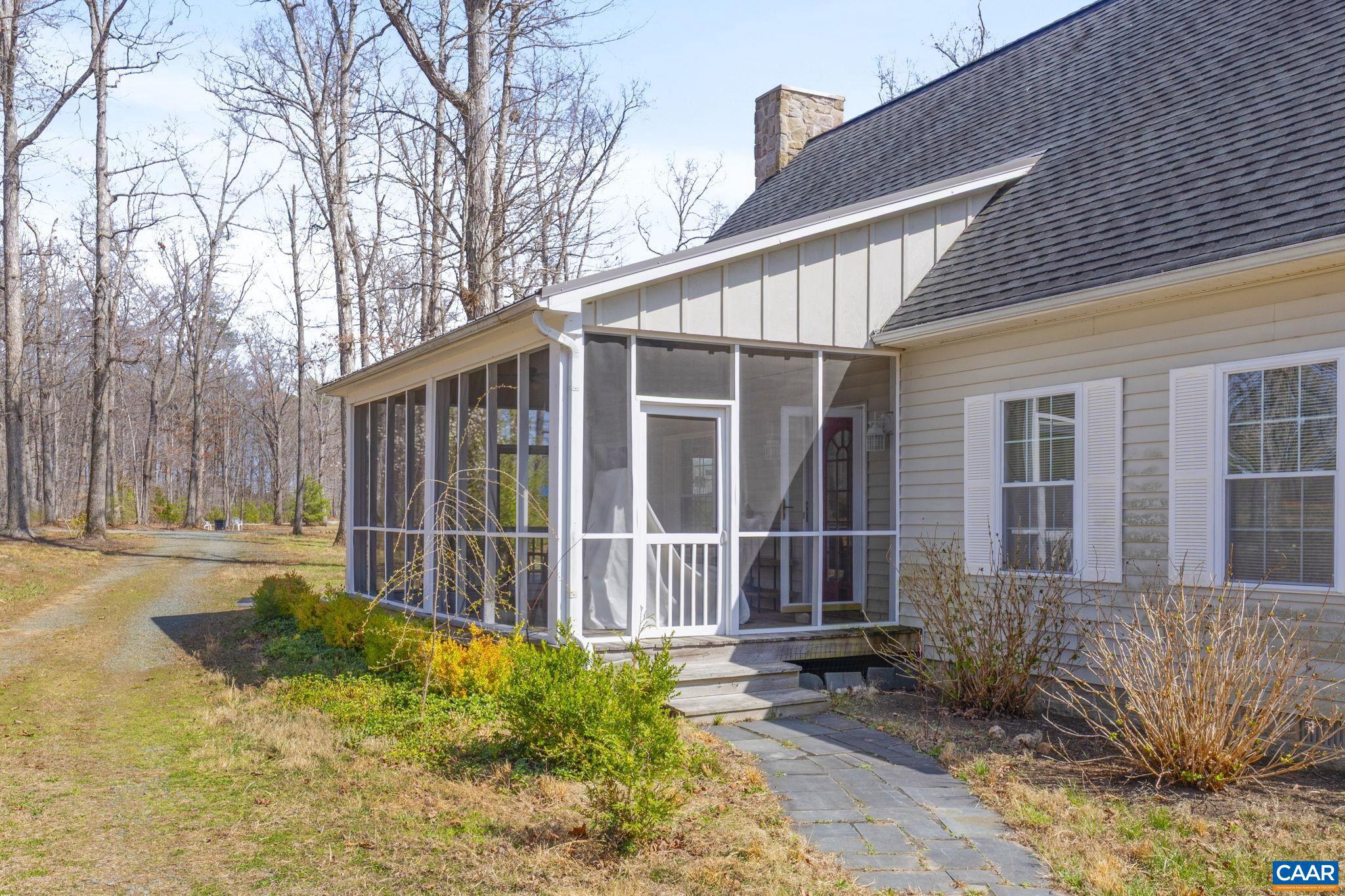 379 Fox Ridge Lane Palmyra, VA 22963 - Photo 4 of 42 a front view of a house with garden