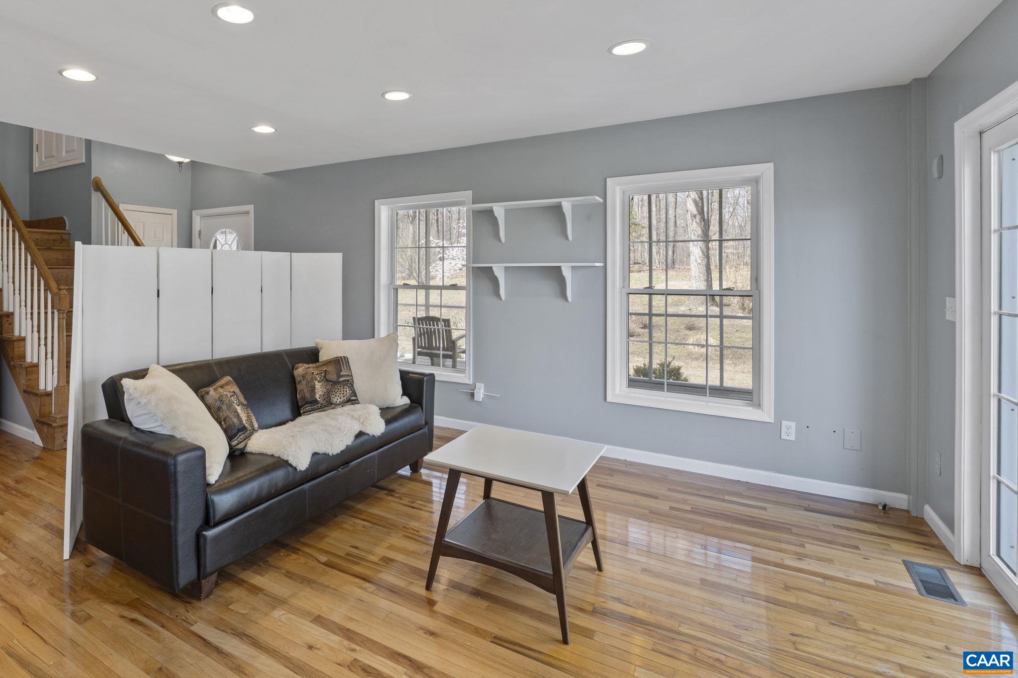 379 Fox Ridge Lane Palmyra, VA 22963 - Photo 9 of 42 a living room with furniture and a wooden floor