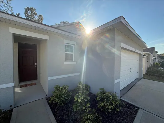 a view of a house with a small yard