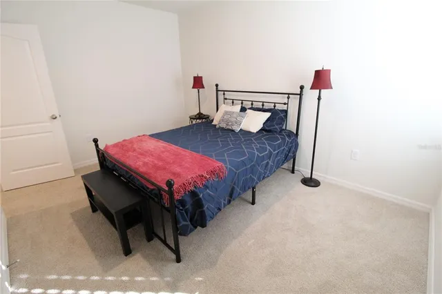 a bedroom with a bed and a closet