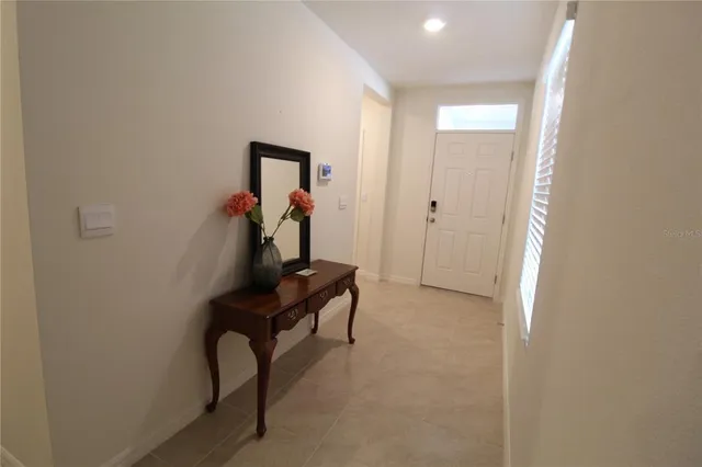a view of a hallway with seating area