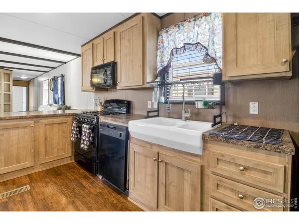 a kitchen with stainless steel appliances granite countertop a stove and a microwave