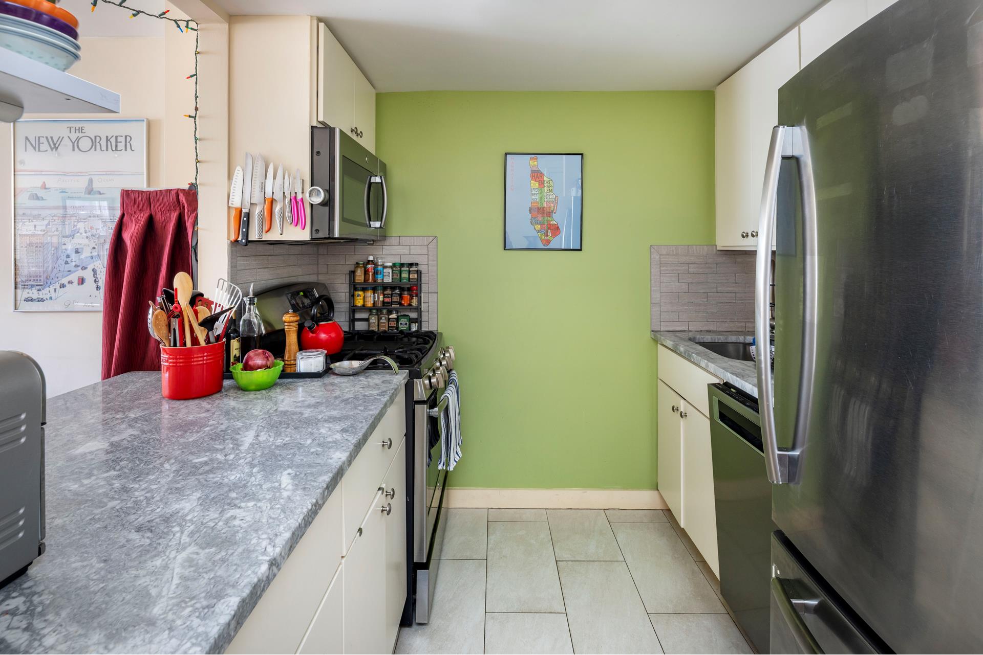 303 West 146th Street, Unit 7F Manhattan, NY 10039 - Photo 5 of 7 a kitchen with stainless steel appliances granite countertop a refrigerator and a stove top oven
