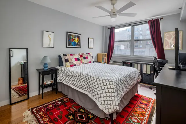 a bedroom with furniture and a window