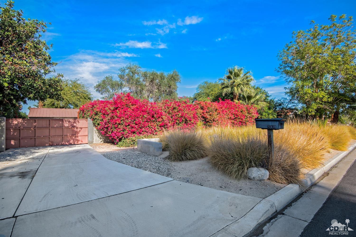 72220 Rancho Road Rancho Mirage, CA 92270 - Photo 1 of 24 a view of a street with flower plants in front of main door